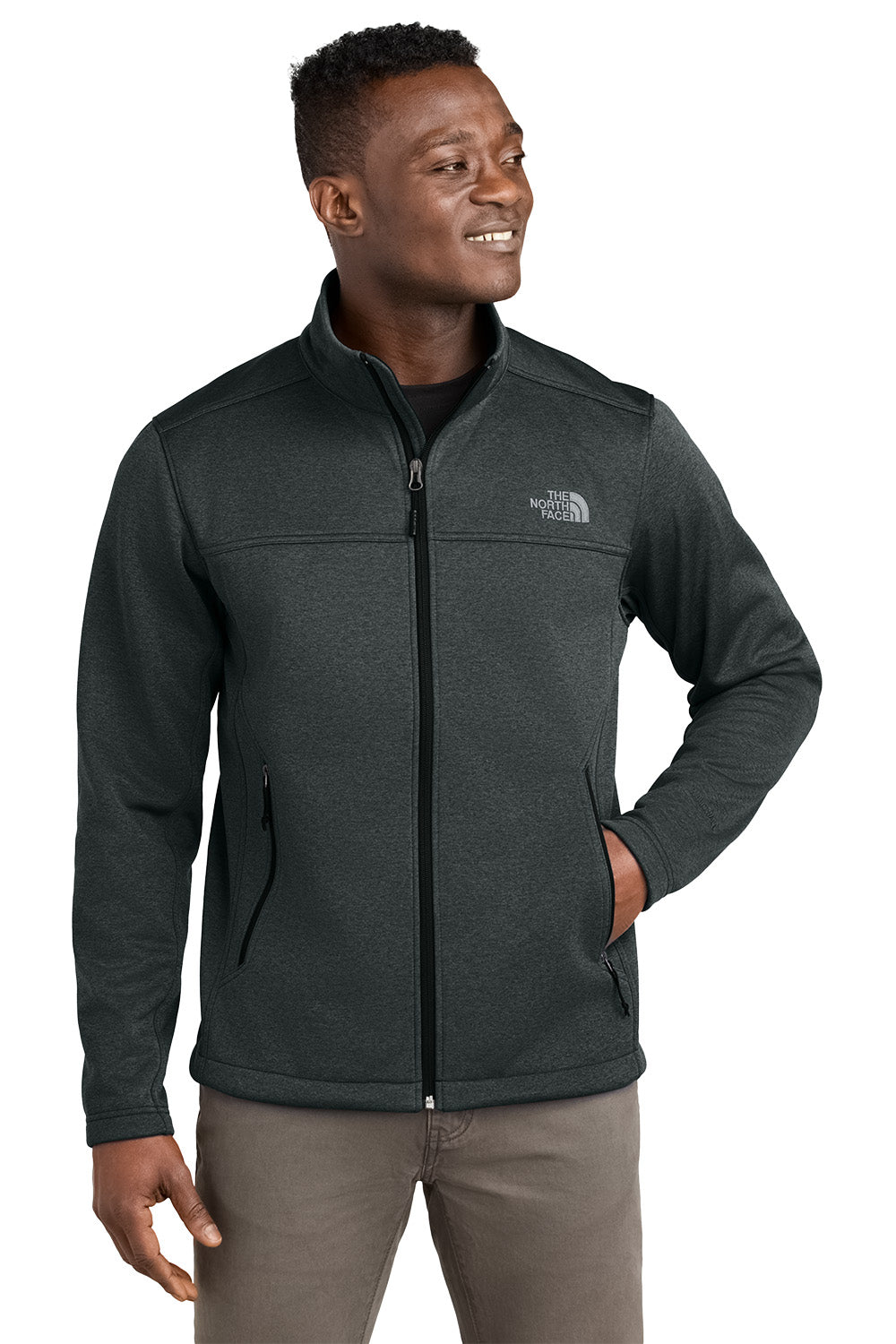 Man wearing a dark gray jacket with The North Face logo on a white background embroidered The North Face® Chest Logo Ridgewall Soft Shell Jacket