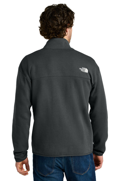 Person wearing a gray fleece jacket with a brand logo on the back, standing against a white background, embroidered The North Face® Double-Knit 1/2-Zip Fleece