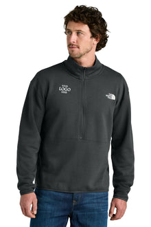 Man wearing a black pullover with a logo on a white background, embroidered The North Face® Double-Knit 1/2-Zip Fleece