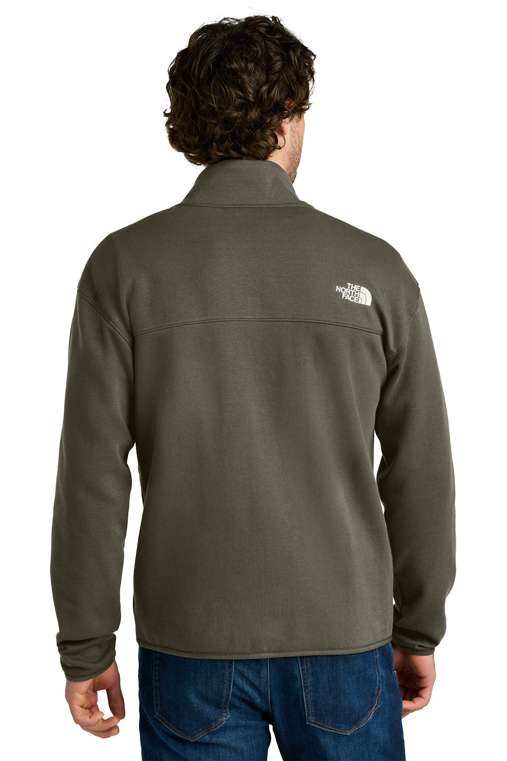Person wearing a green fleece jacket with a brand logo on the back, standing against a white background, embroidered The North Face® Double-Knit 1/2-Zip Fleece