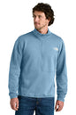 Man wearing a light blue pullover with a brand logo on a white background embroidered The North Face® Double-Knit 1/2-Zip Fleece