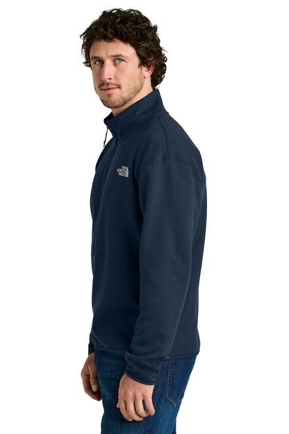 Man wearing a navy blue fleece jacket with a logo on a white background embroidered The North Face® Double-Knit 1/2-Zip Fleece