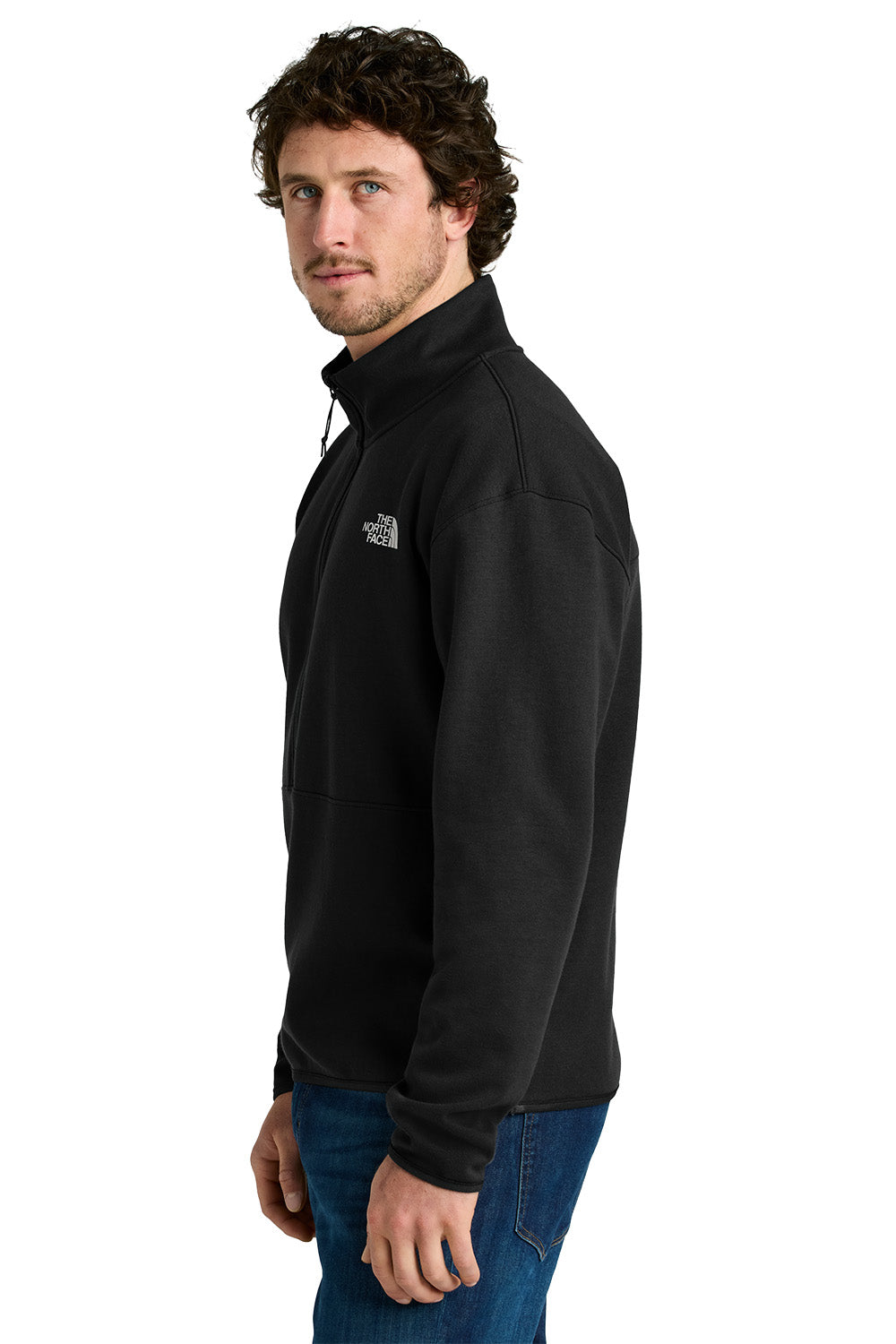 Man wearing a black fleece jacket with a logo on a white background embroidered The North Face® Double-Knit 1/2-Zip Fleece