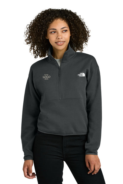 Person wearing a gray pullover with a logo on a white background embroidered The North Face® Women's Double-Knit 1/2-Zip Fleece