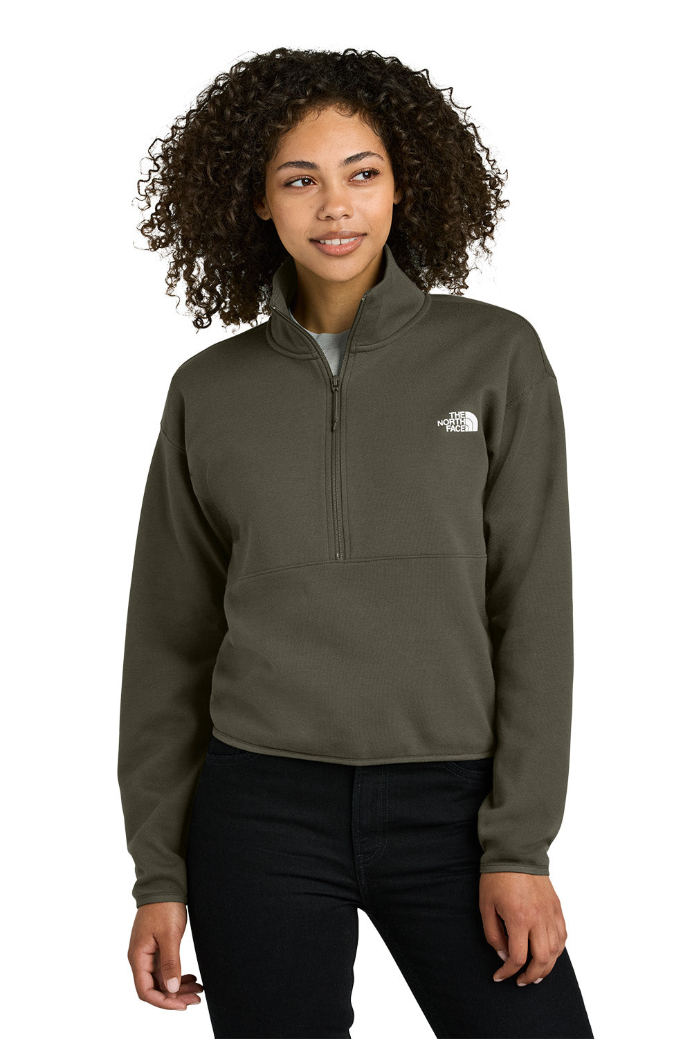 Woman wearing a green pullover with a logo on a white background embroidered The North Face® Women's Double-Knit 1/2-Zip Fleece