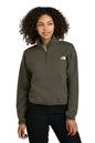 Woman wearing a green pullover with a logo on a white background embroidered The North Face® Women's Double-Knit 1/2-Zip Fleece