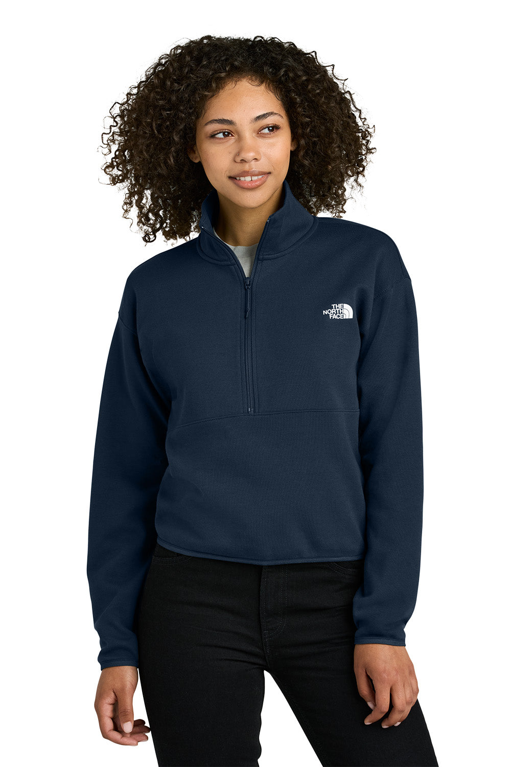Woman wearing a navy blue pullover with a logo on a white background embroidered The North Face® Women's Double-Knit 1/2-Zip Fleece