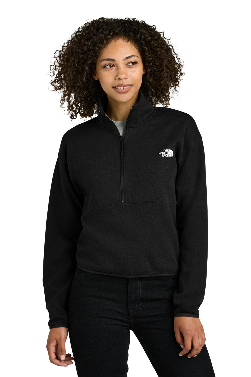 Person wearing a black pullover with a brand logo on a white background embroidered The North Face® Women's Double-Knit 1/2-Zip Fleece
