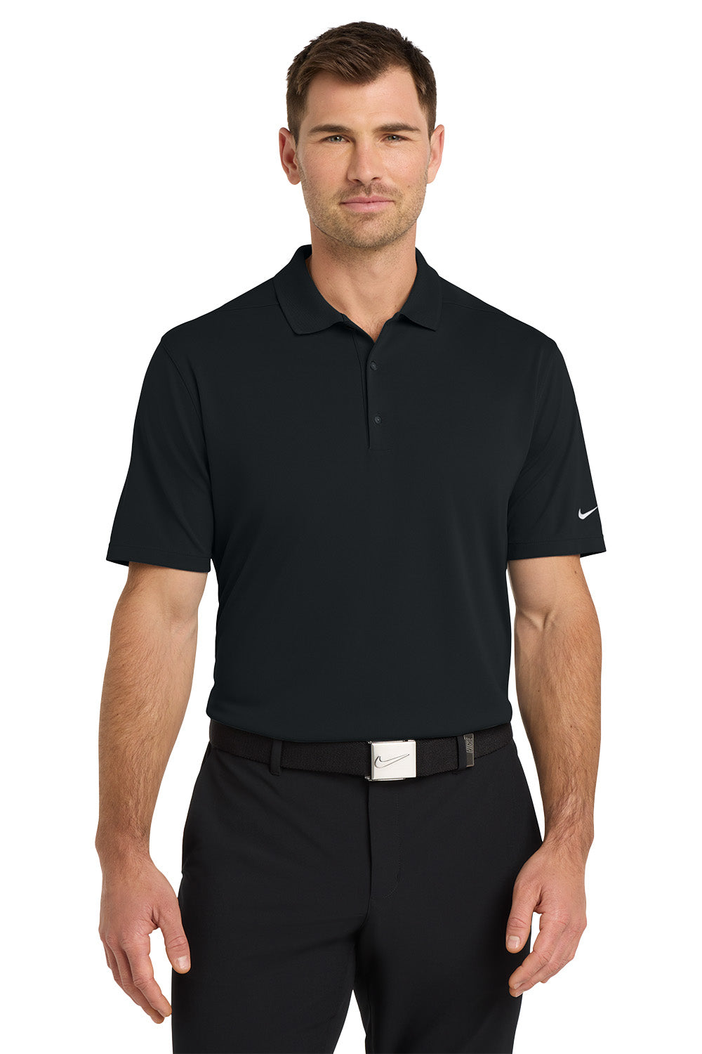 Man wearing a black Nike polo shirt and pants on a white background. Nike Dri-FIT Micro Pique 2.0 Polo, Embroidered by Helmsman Stitch Co.