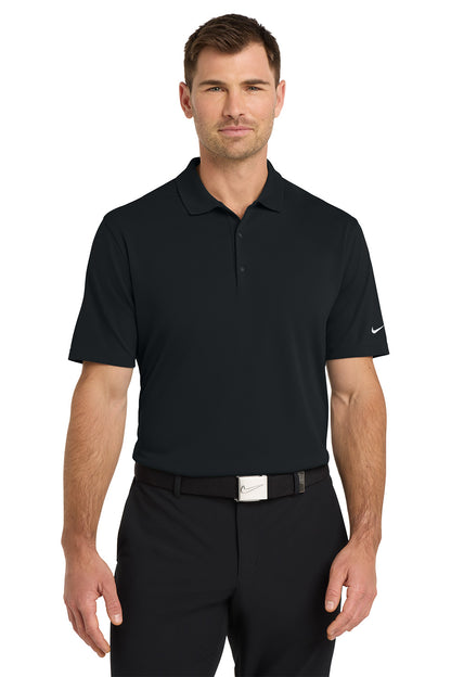Man wearing a black Nike polo shirt and pants on a white background. Nike Dri-FIT Micro Pique 2.0 Polo, Embroidered by Helmsman Stitch Co.