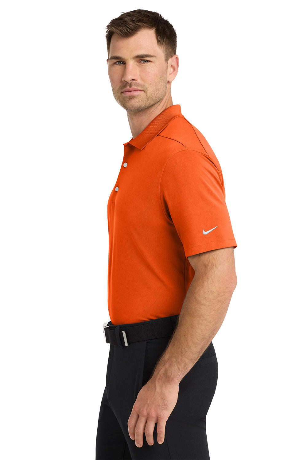 Man wearing an orange Nike polo shirt on a white background. Nike Dri-FIT Micro Pique 2.0 Polo, Embroidered by Helmsman Stitch Co.