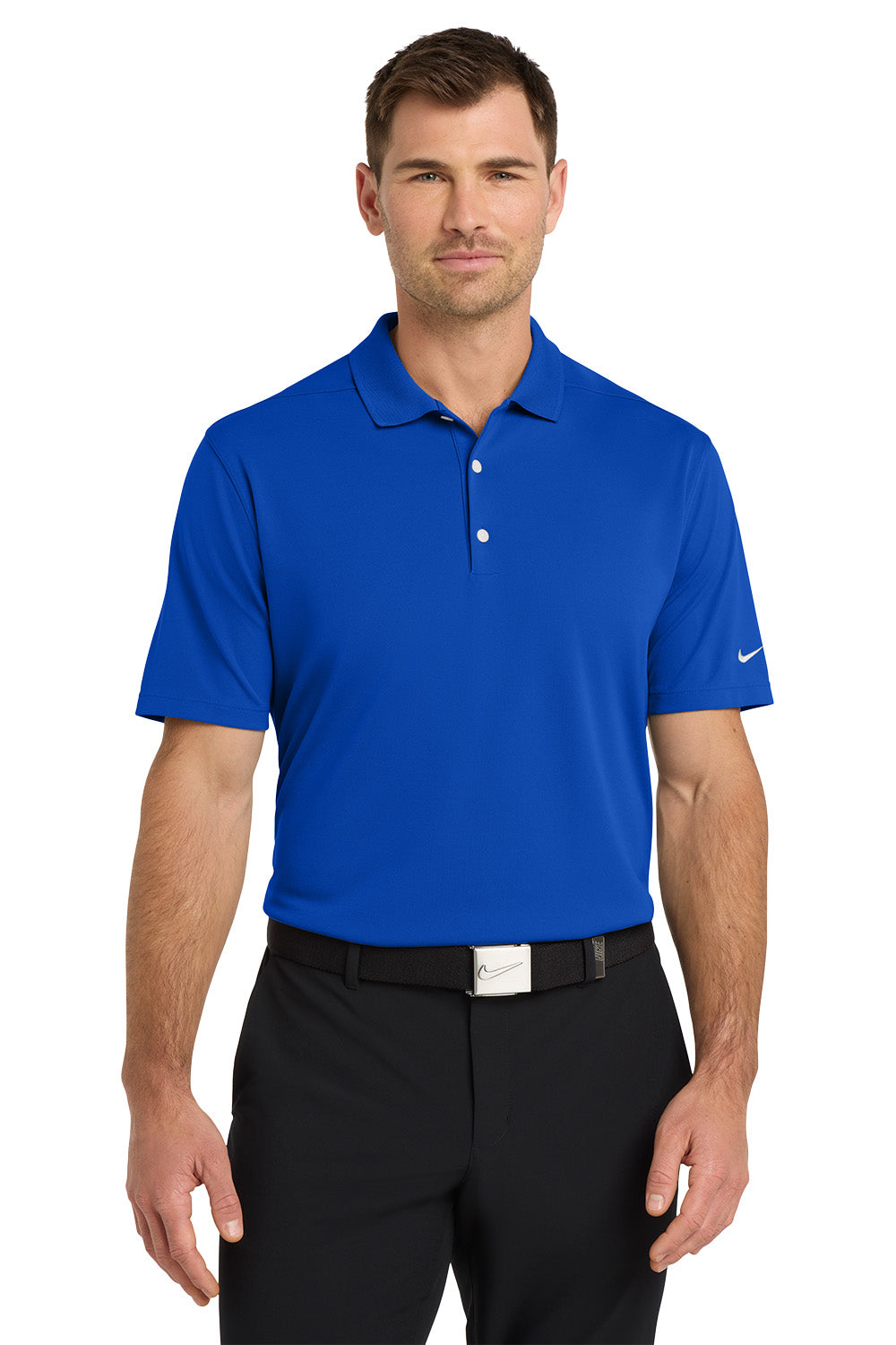Man wearing a blue Nike polo shirt and black pants on a white background. Nike Dri-FIT Micro Pique 2.0 Polo, Embroidered by Helmsman Stitch Co.