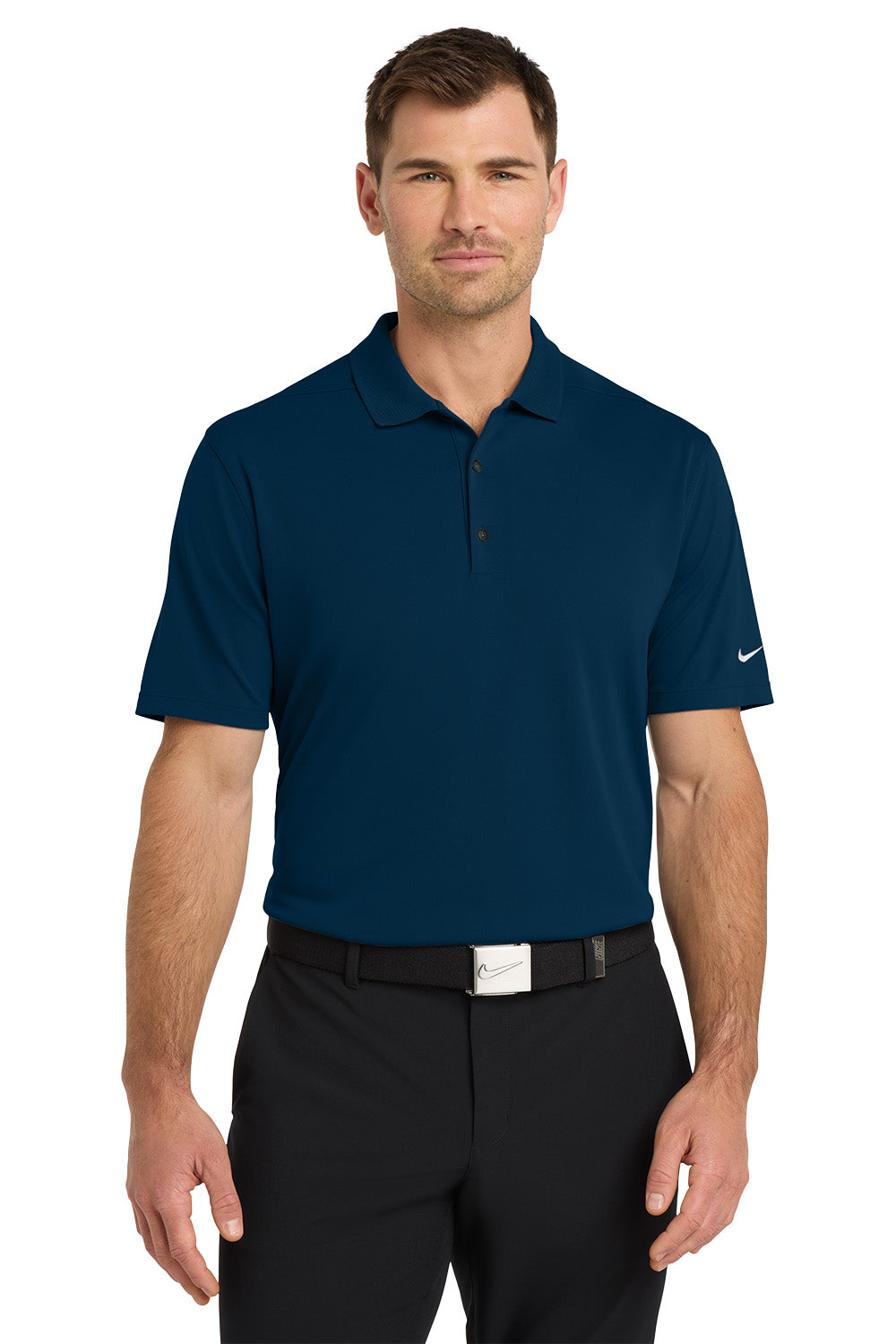 Man wearing a navy blue polo shirt with a Nike logo on a white background. Nike Dri-FIT Micro Pique 2.0 Polo, Embroidered by Helmsman Stitch Co.