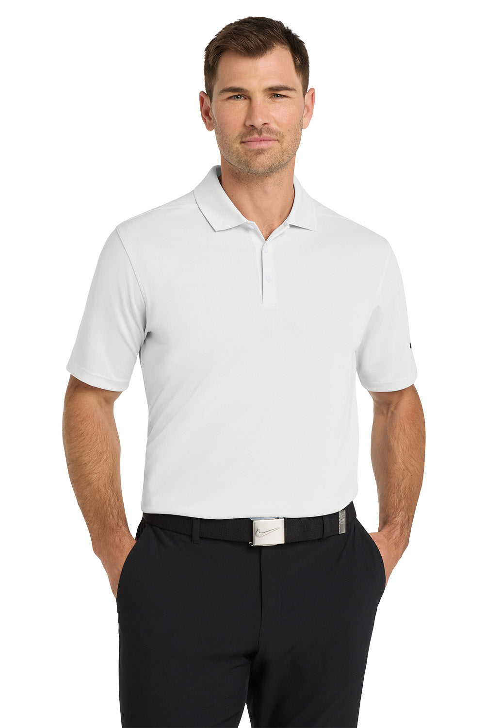 Man wearing a white polo shirt and black pants on a white background. Nike Dri-FIT Micro Pique 2.0 Polo, Embroidered by Helmsman Stitch Co.