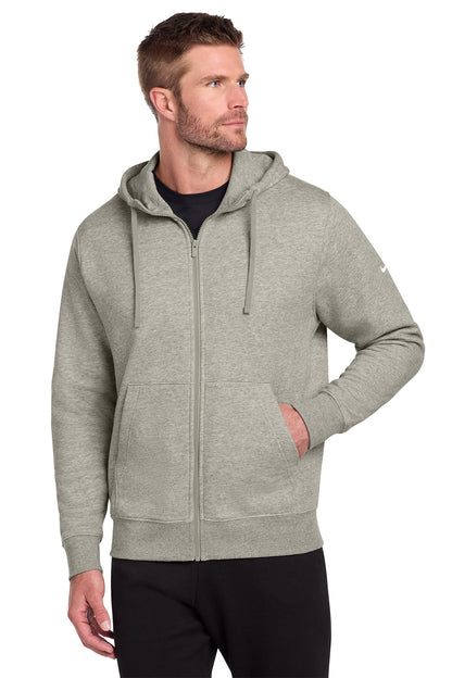 Man wearing a gray hoodie on a white background, embroidered Nike Club Fleece Sleeve Swoosh Full-Zip Hoodie