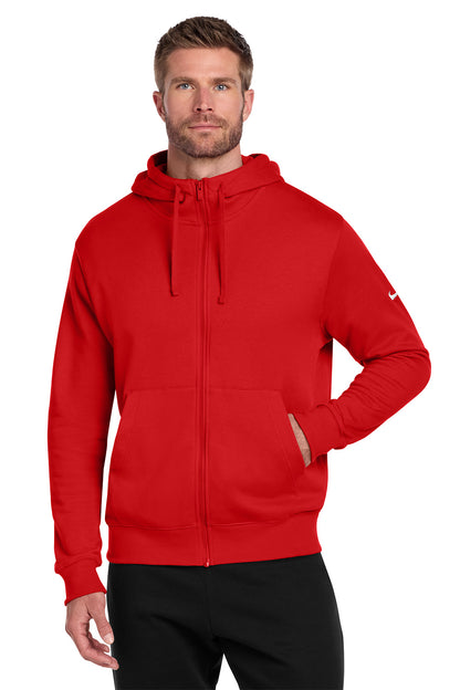Man wearing a red hoodie with a Nike logo on a white background, embroidered Nike Club Fleece Sleeve Swoosh Full-Zip Hoodie