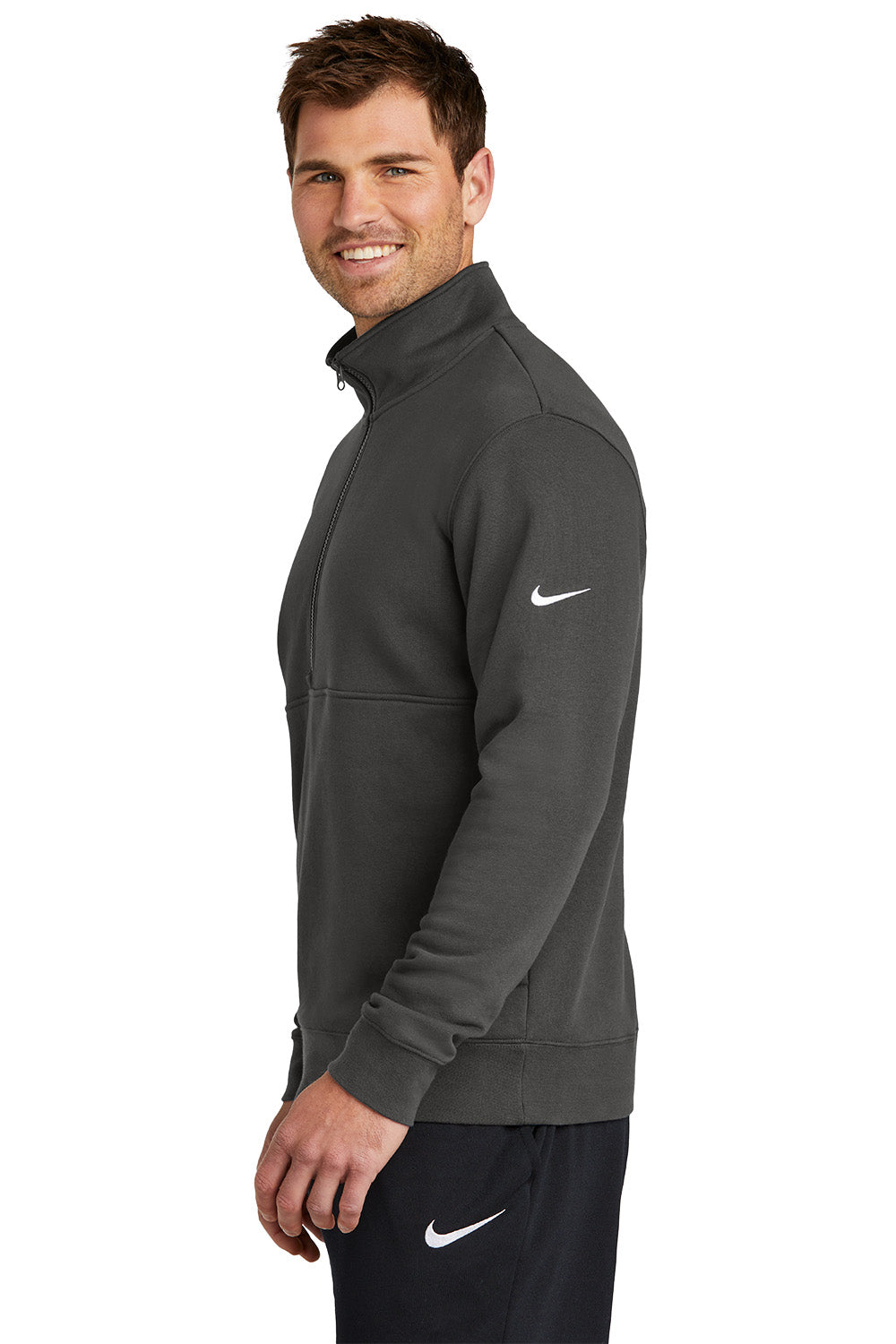 Man wearing a gray Nike jacket on a white background, Embroidered Nike Club Fleece Sleeve Swoosh 1/2-Zip