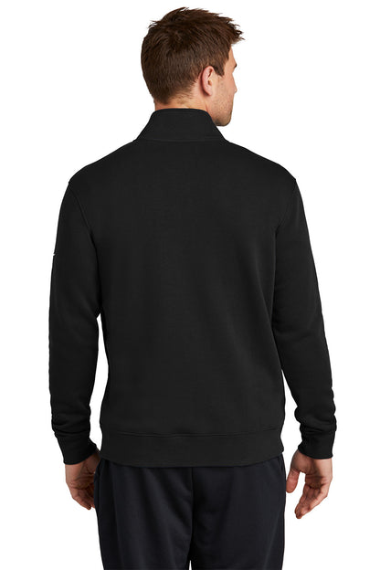 Man wearing a black pullover with a white background, Embroidered Nike Club Fleece Sleeve Swoosh 1/2-Zip