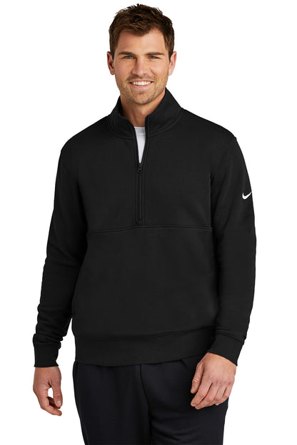 Man wearing a black Nike quarter-zip sweatshirt on a white background, Embroidered Nike Club Fleece Sleeve Swoosh 1/2-Zip