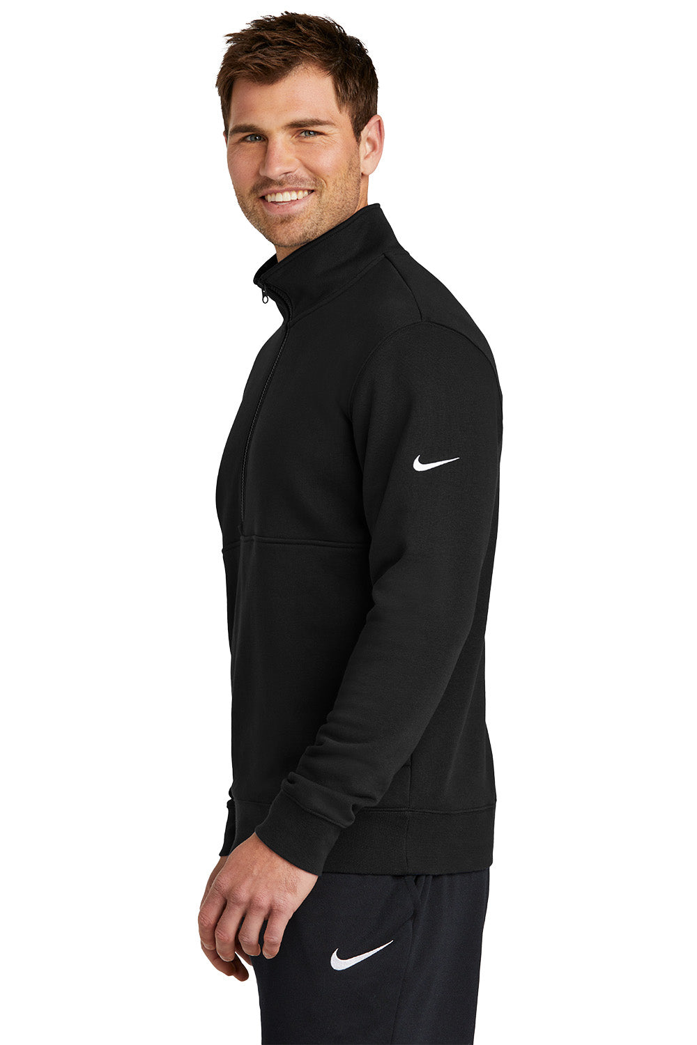 Man wearing a black Nike jacket on a white background, Embroidered Nike Club Fleece Sleeve Swoosh 1/2-Zip