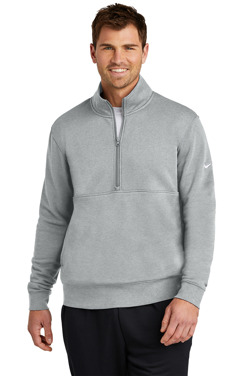 Man wearing a gray Nike half-zip pullover on a white background, Embroidered Nike Club Fleece Sleeve Swoosh 1/2-Zip