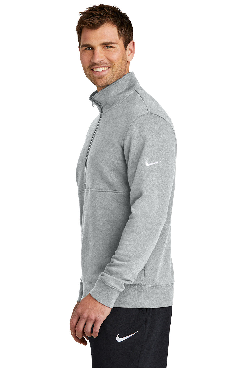 Man wearing a gray Nike jacket on a white background, Embroidered Nike Club Fleece Sleeve Swoosh 1/2-Zip