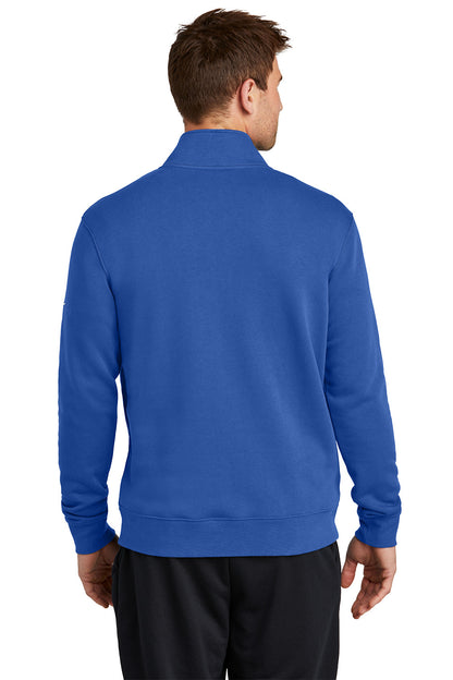 Person wearing a blue pullover with a white background, Embroidered Nike Club Fleece Sleeve Swoosh 1/2-Zip