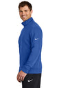 Man wearing a blue Nike jacket on a white background, Embroidered Nike Club Fleece Sleeve Swoosh 1/2-Zip