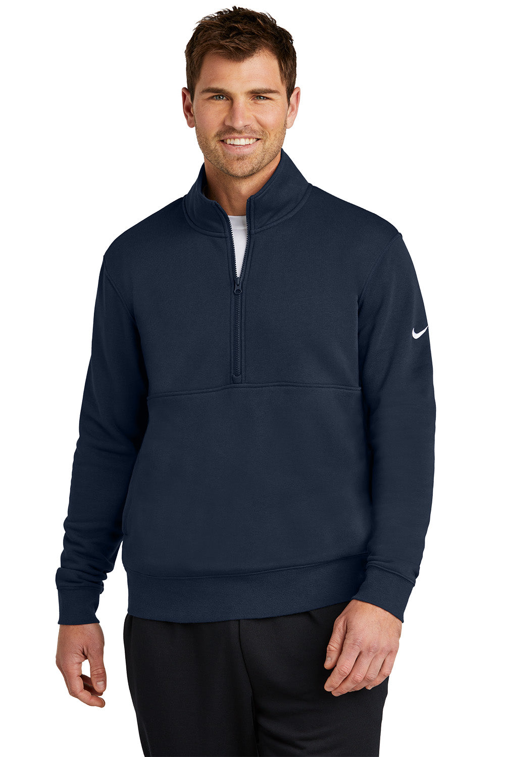 Man wearing a navy blue Nike half-zip pullover on a white background, Embroidered Nike Club Fleece Sleeve Swoosh 1/2-Zip