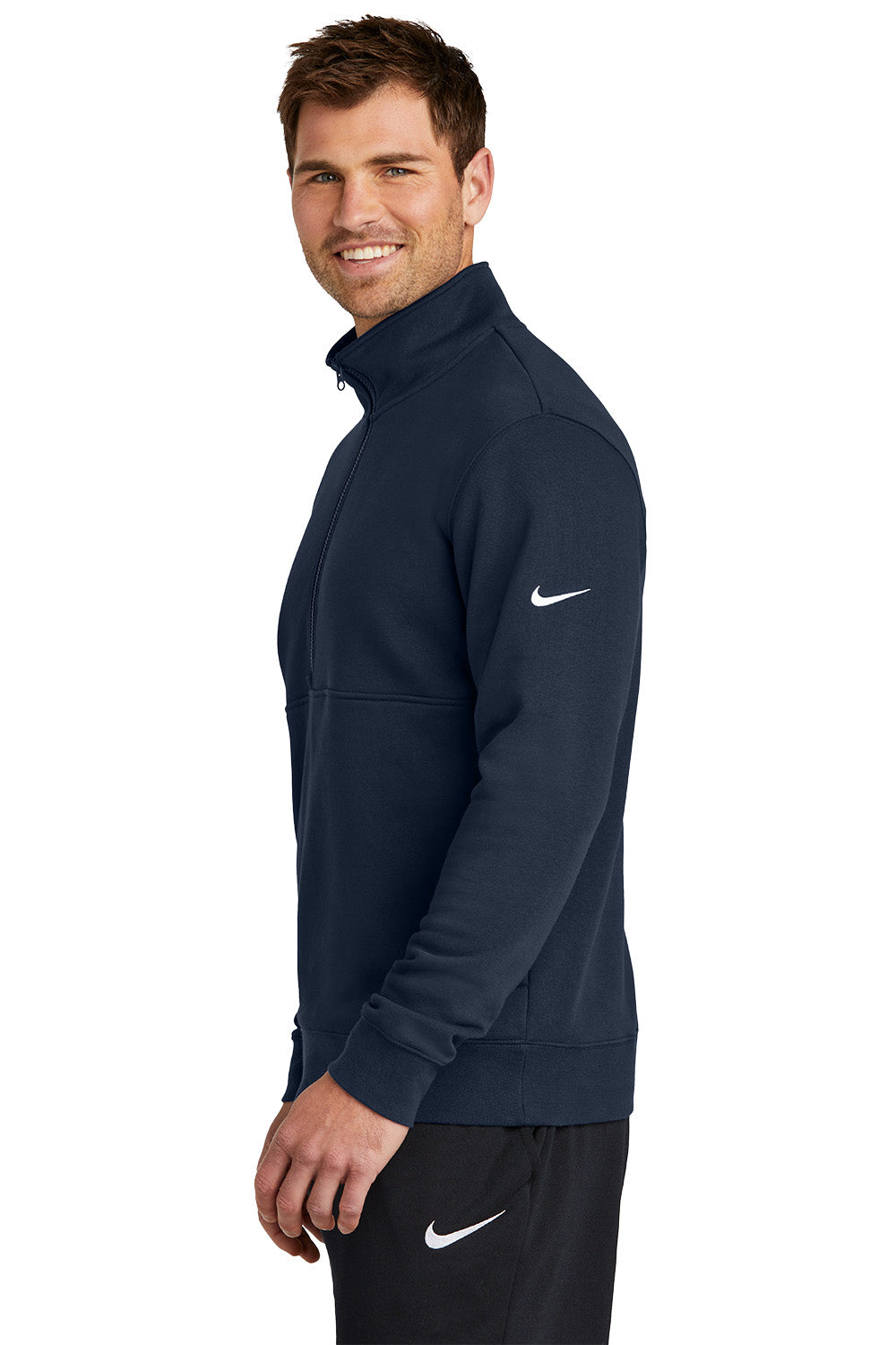 Man wearing a navy blue Nike jacket on a white background, Embroidered Nike Club Fleece Sleeve Swoosh 1/2-Zip