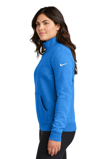 Woman wearing a blue jacket with a white logo on a white background, Embroidered Nike Women's Club Fleece Sleeve Swoosh 1/2-Zip