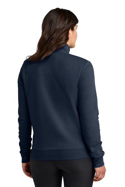 Person wearing a navy blue pullover with a high collar on a white background, Embroidered Nike Women's Club Fleece Sleeve Swoosh 1/2-Zip