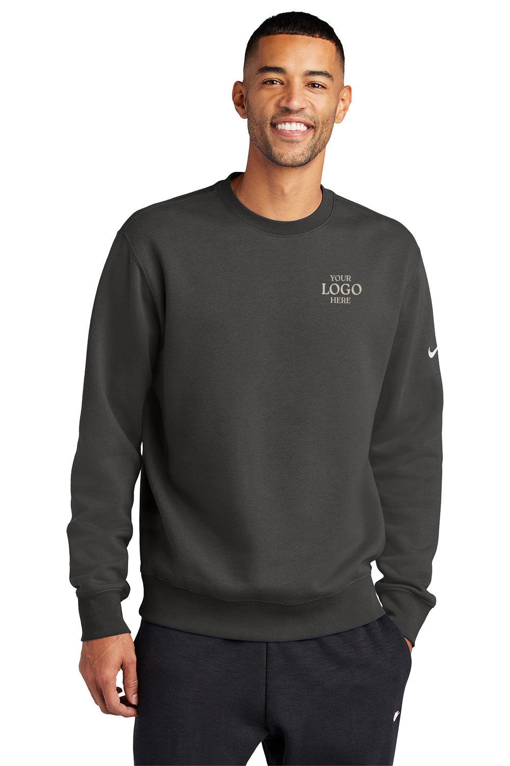 Man wearing a dark gray sweatshirt with 'Your Logo Here' text on a white background, Embroidered Nike Club Fleece Sleeve Swoosh Crew