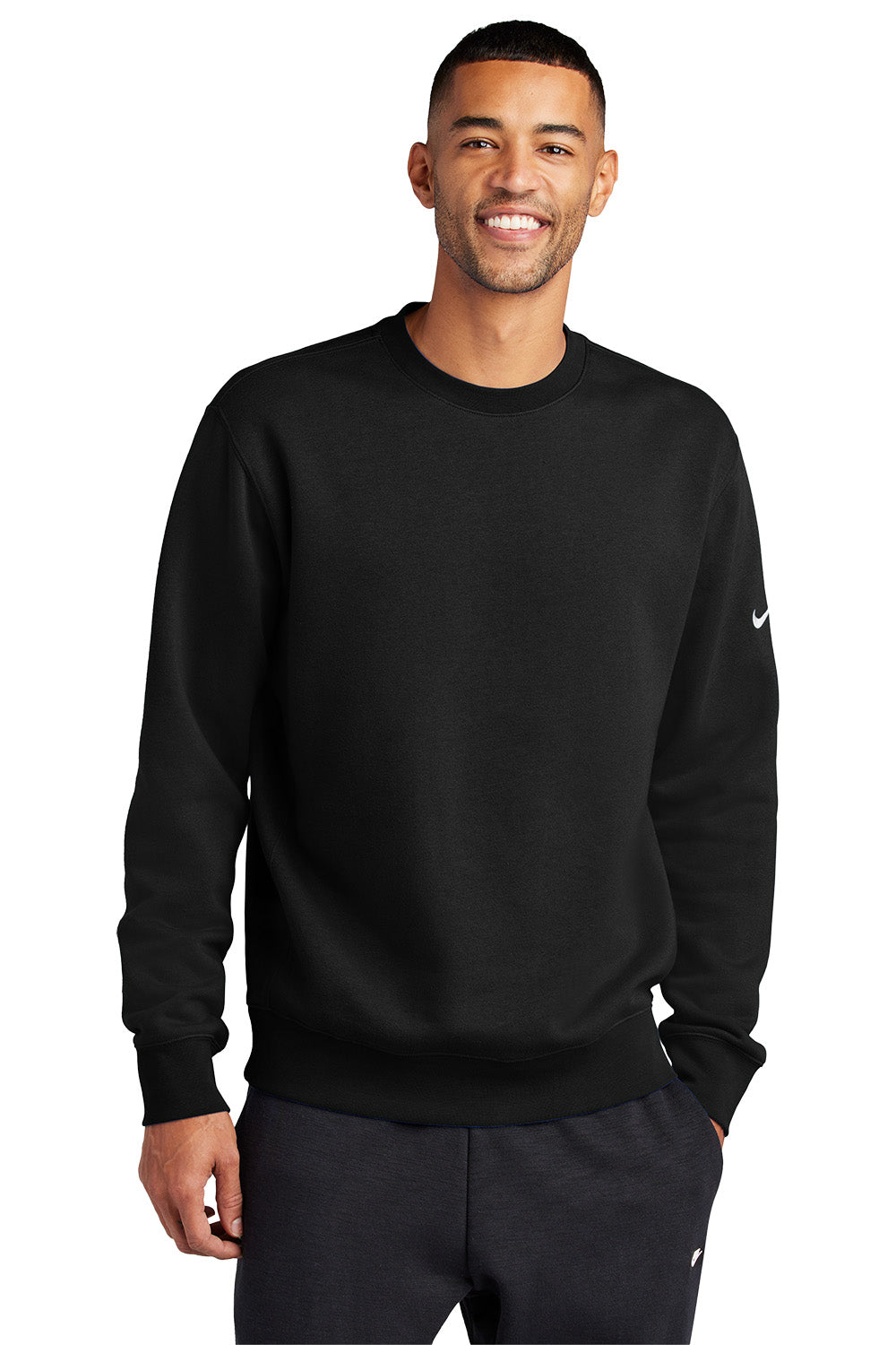 Man wearing a black Nike sweatshirt on a white background embroidered Nike Club Fleece Sleeve Swoosh Crew