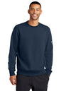Man wearing a navy blue Nike sweatshirt on a white background embroidered Nike Club Fleece Sleeve Swoosh Crew