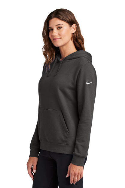 Woman wearing a dark gray hoodie with a Nike logo on a white background, Embroidered Nike Women's Club Fleece Sleeve Swoosh Hoodie
