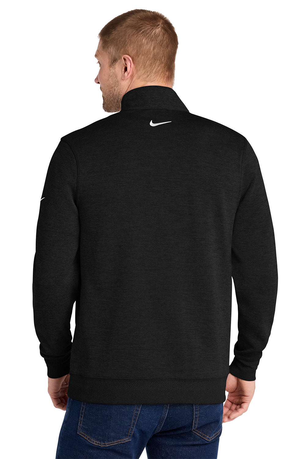 A man viewed from the back wearing a black Nike quarter-zip pullover sweatshirt and blue jeans, set against a plain white background. Nike Dri-FIT Corporate 1/2-Zip, Embroidered