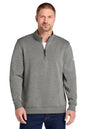A man wearing a heather gray quarter-zip pullover sweatshirt with a mock neck, paired with dark blue jeans, photographed against a solid white background. Nike Dri-FIT Corporate 1/2-Zip, Embroidered