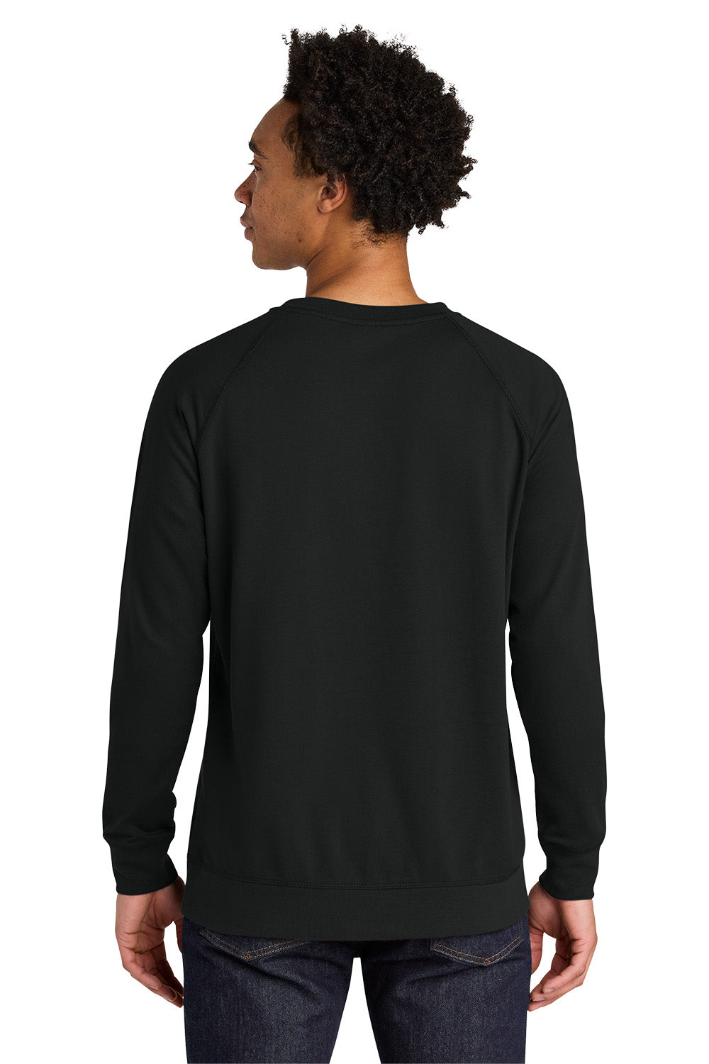 A man viewed from the back wearing a plain black long-sleeve crewneck sweatshirt and dark blue jeans against a white studio background. Next Level Apparel® Laguna Raglan Sweatshirt, Embroidered