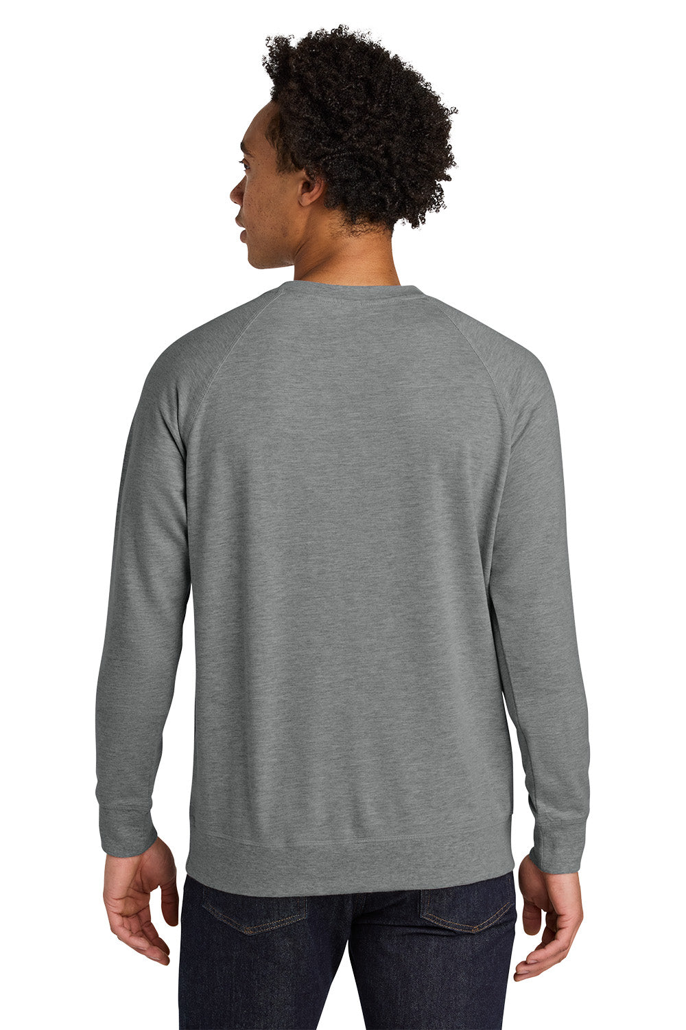 Person wearing a gray long-sleeve shirt on a white background. Next Level Apparel® Laguna Raglan Sweatshirt, Embroidered
