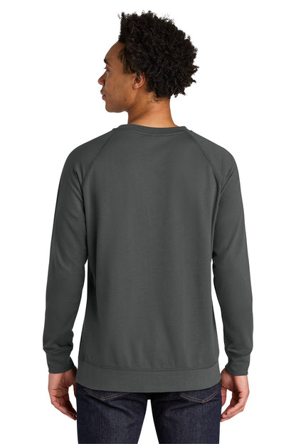 A man viewed from the back wearing a dark gray crewneck sweatshirt and dark blue jeans, set against a plain white background. Next Level Apparel® Laguna Raglan Sweatshirt, Embroidered
