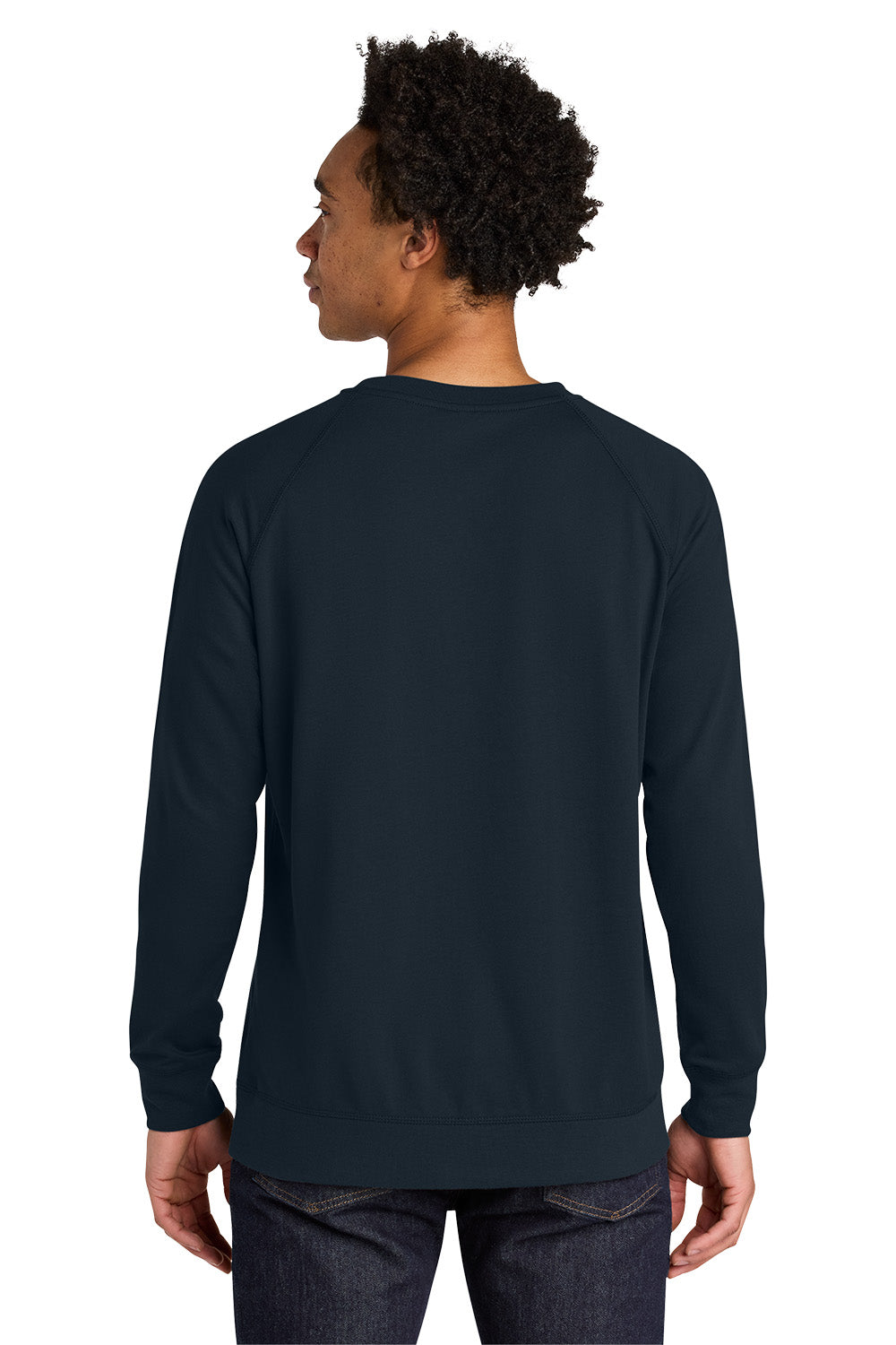 A man viewed from the back wearing a dark navy blue crewneck sweatshirt and dark jeans against a plain white background. Next Level Apparel® Laguna Raglan Sweatshirt, Embroidered