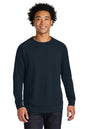 Man wearing a navy blue sweatshirt on a white background. Next Level Apparel® Laguna Raglan Sweatshirt, Embroidered