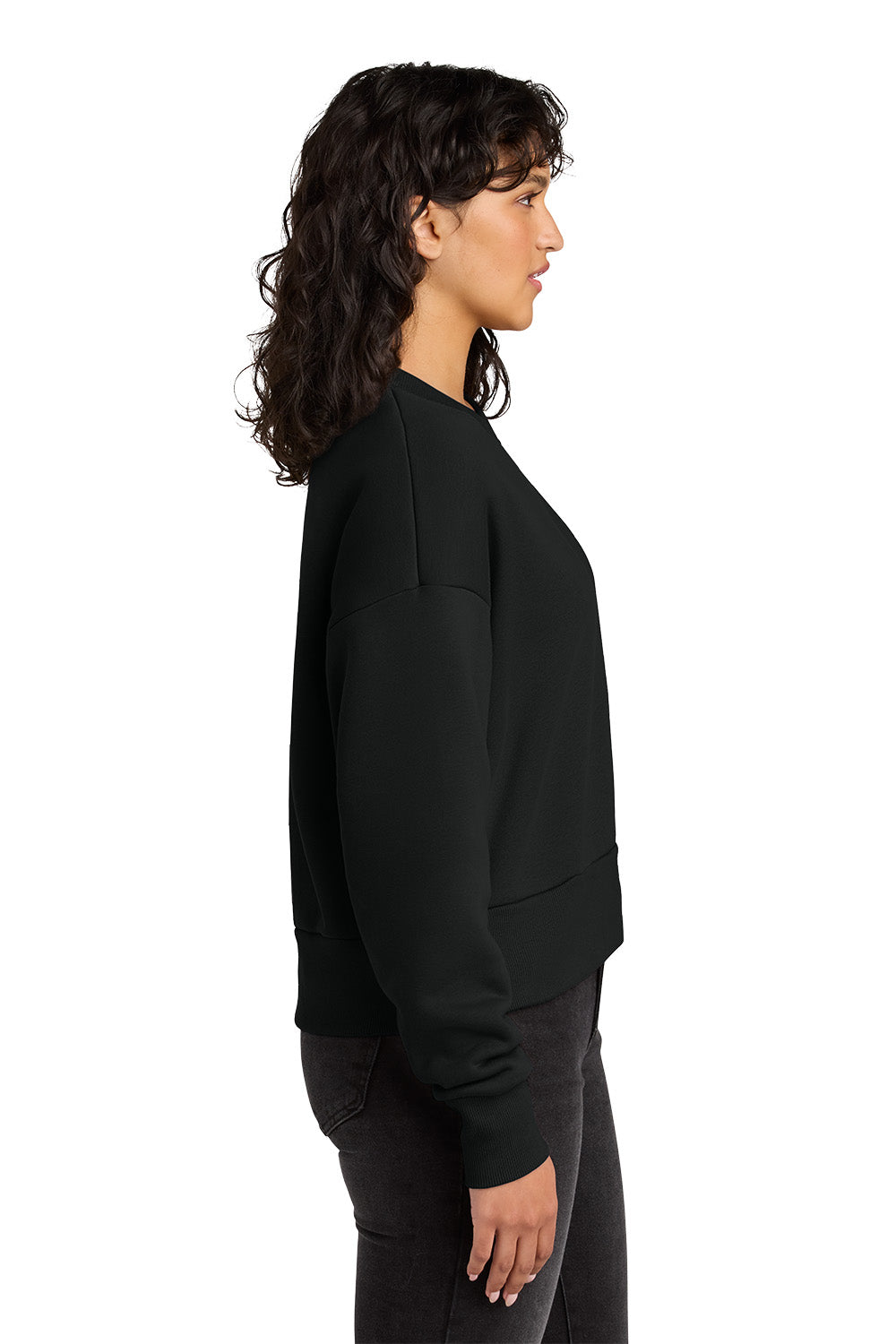 Woman wearing a black sweatshirt on a white background. Next Level Apparel® Women’s Heavyweight Sweatshirt, Embroidered