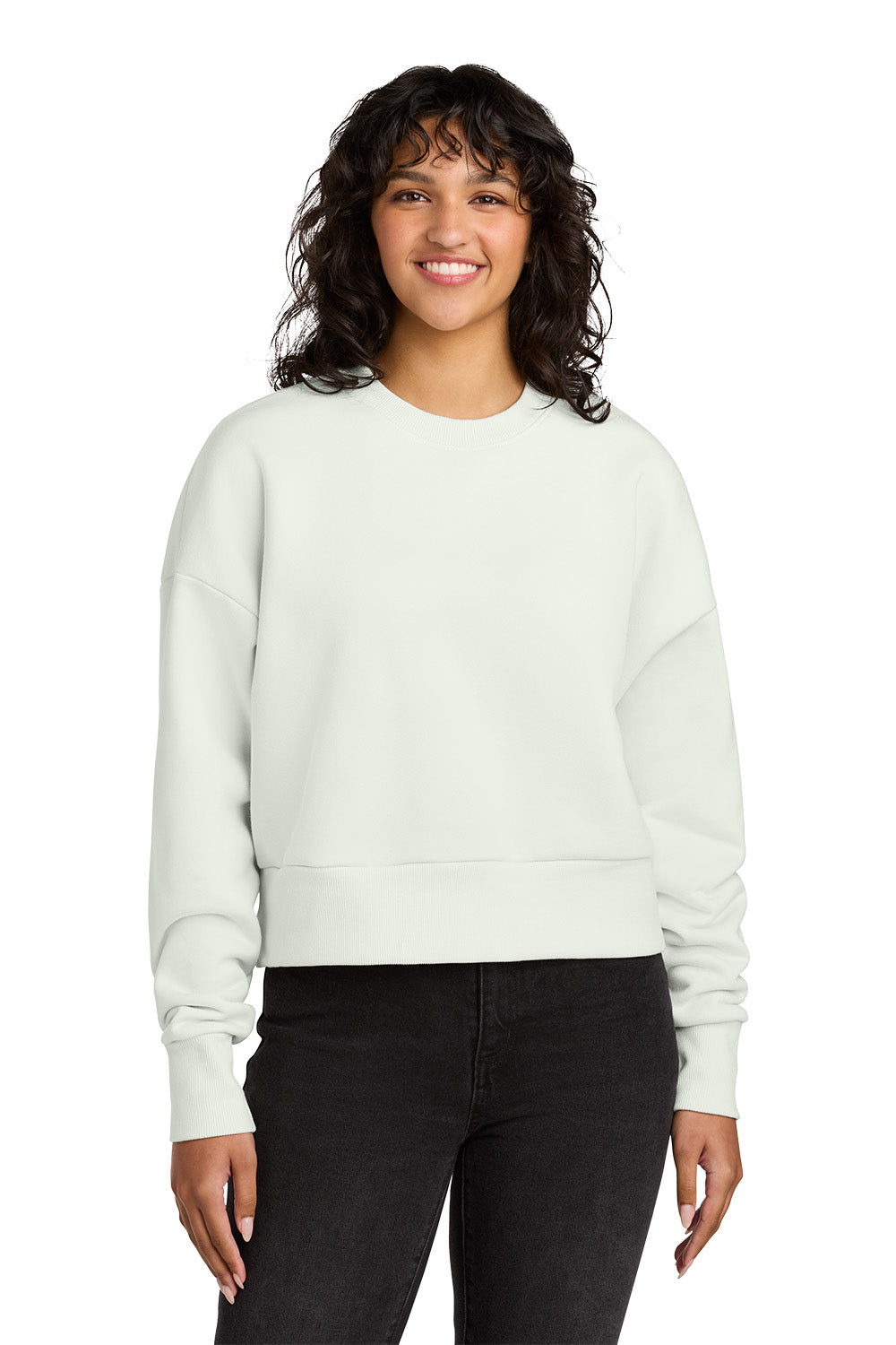 Woman wearing a light gray sweatshirt and black pants on a white background. Next Level Apparel® Women’s Heavyweight Sweatshirt, Embroidered
