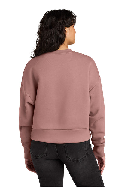 Person wearing a mauve sweatshirt from behind on a white background. Next Level Apparel® Women’s Heavyweight Sweatshirt, Embroidered