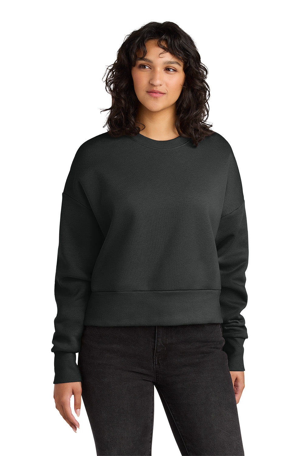 Person wearing a black sweatshirt and pants on a white background. Next Level Apparel® Women’s Heavyweight Sweatshirt, Embroidered