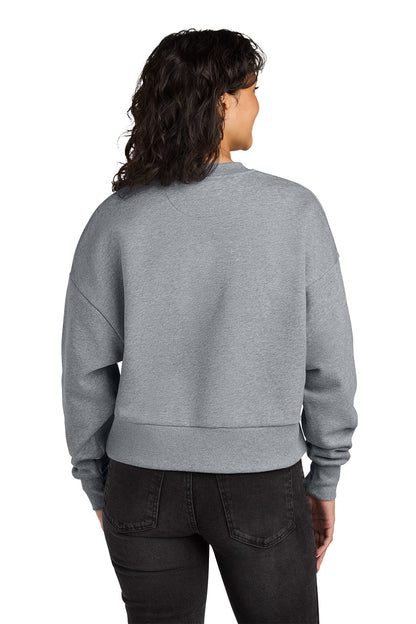 Person wearing a gray sweatshirt from behind on a white background. Next Level Apparel® Women’s Heavyweight Sweatshirt, Embroidered