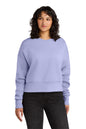 Woman wearing a light purple sweatshirt on a white background. Next Level Apparel® Women’s Heavyweight Sweatshirt, Embroidered