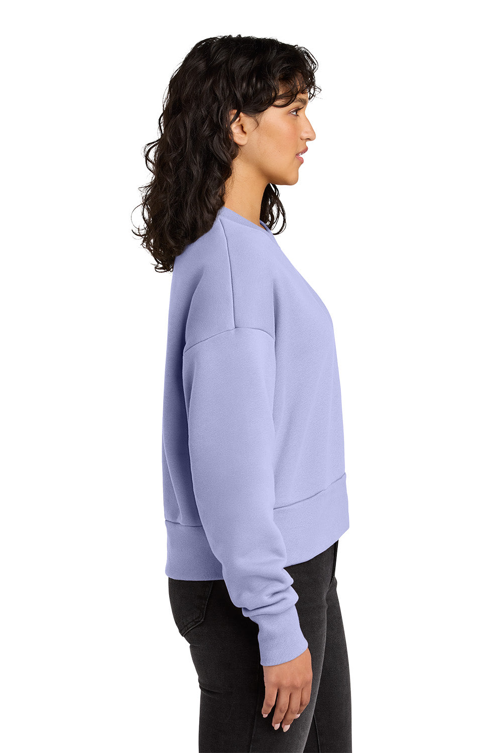 Woman wearing a light purple sweatshirt on a white background. Next Level Apparel® Women’s Heavyweight Sweatshirt, Embroidered